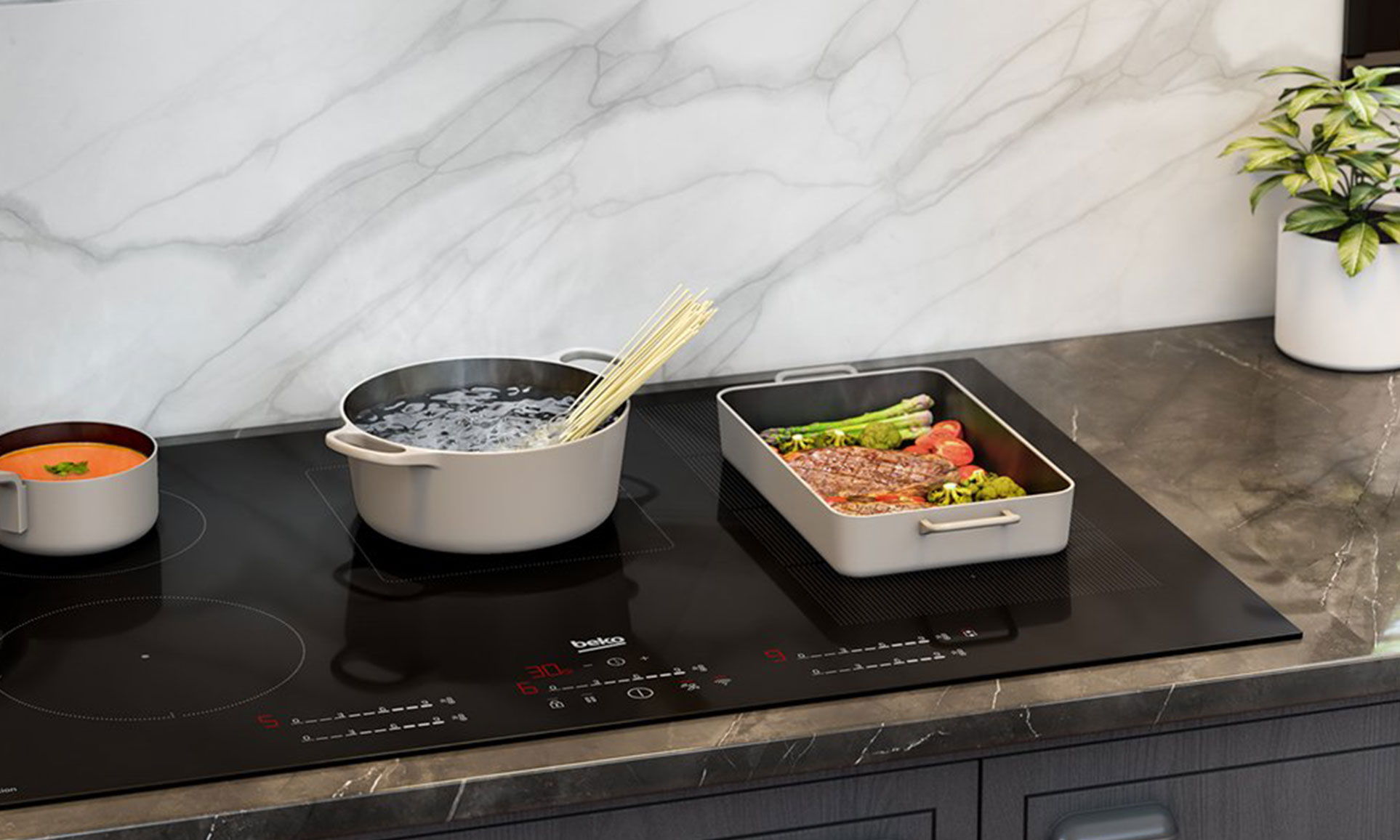 Eine große Herdplatte von der Marke Beko mit unterschiedlich großen Kochfeldern– einem qualifizierten Partner von Heiser's Küchen